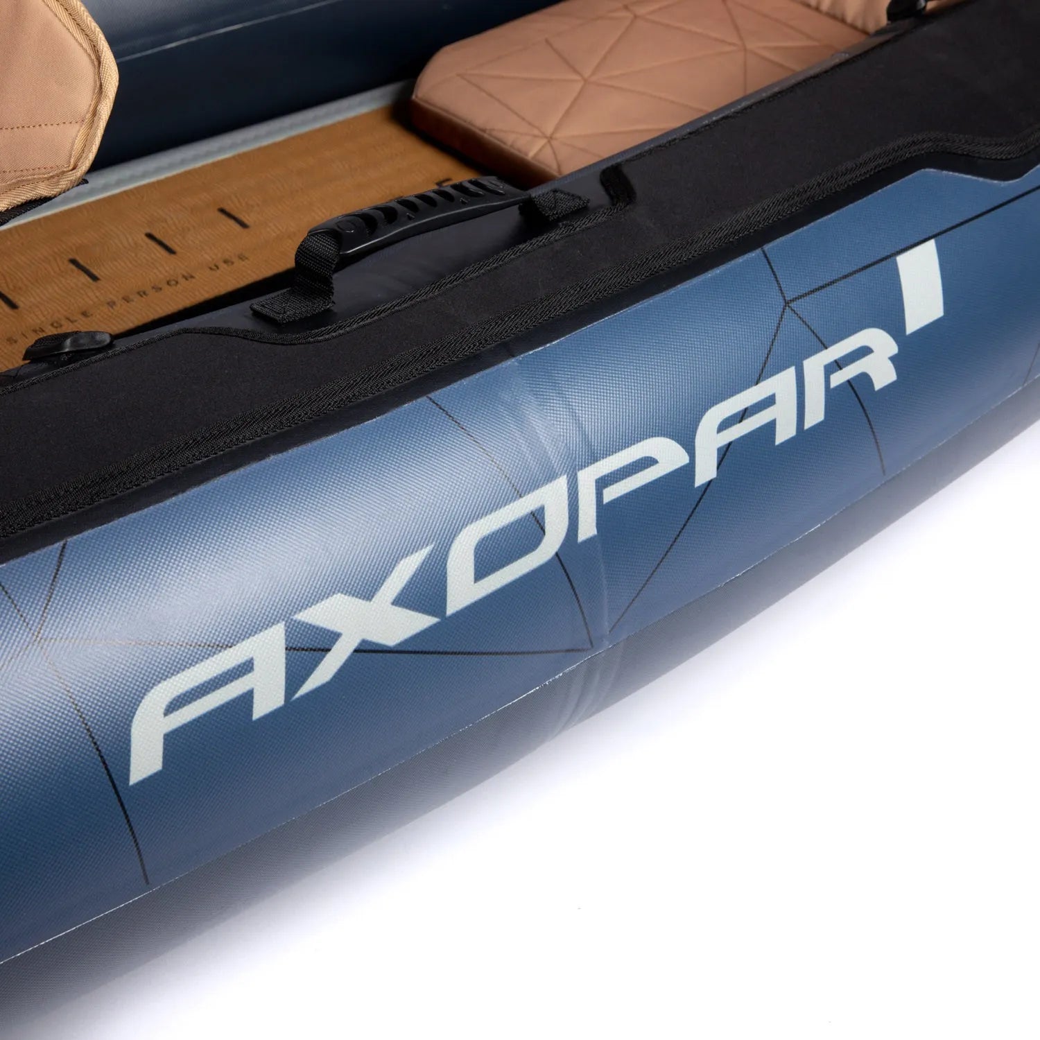 Close-up of a blue AXOPAR inflatable boat with brown interior on a white background